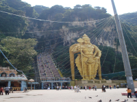 A statue of Lord Murugan in front of the Batu Caves